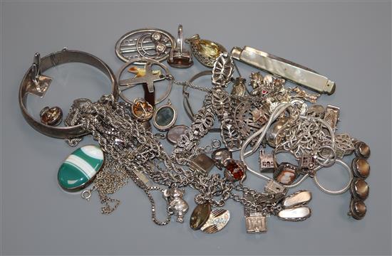 A group of assorted silver and white metal jewellery including charm bracelet.